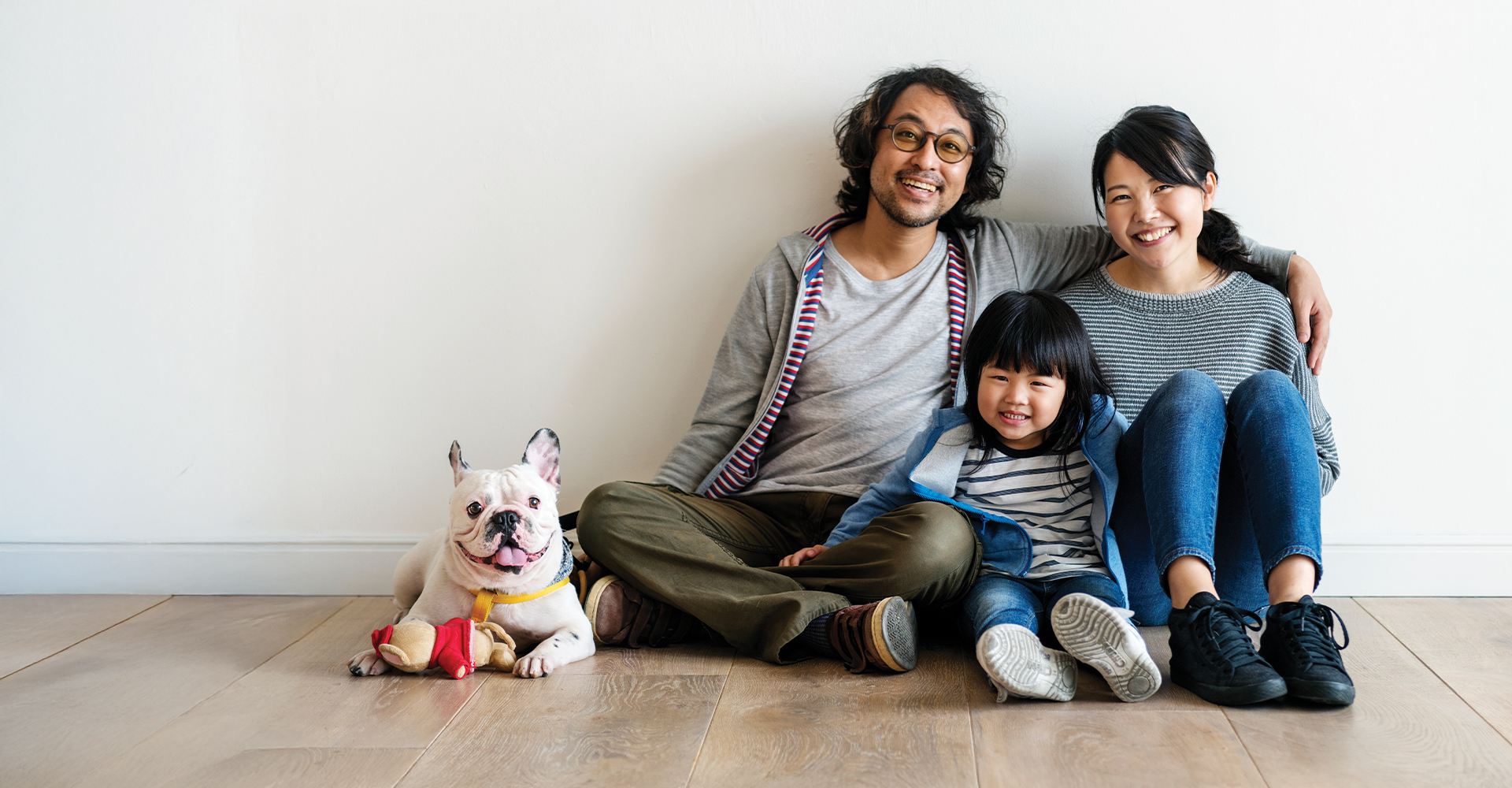 Child on Luxury Vinyl Floor putting Money in Piggy Bank